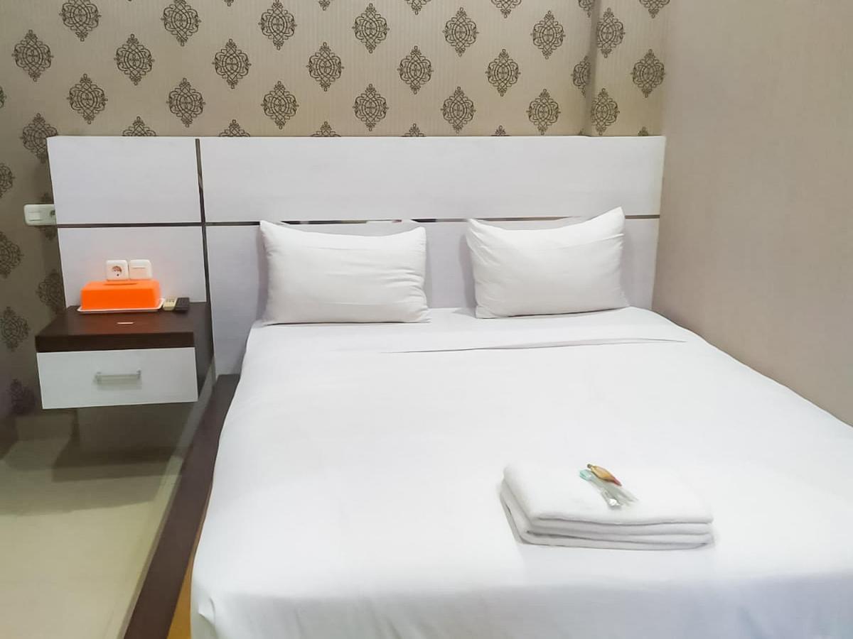 Hotel Reddoorz Syariah Near Sultan Syarif Kasim II Airport à Pekanbaru Extérieur photo